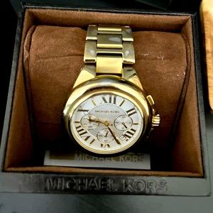 Gold colored Michael Kors watch.